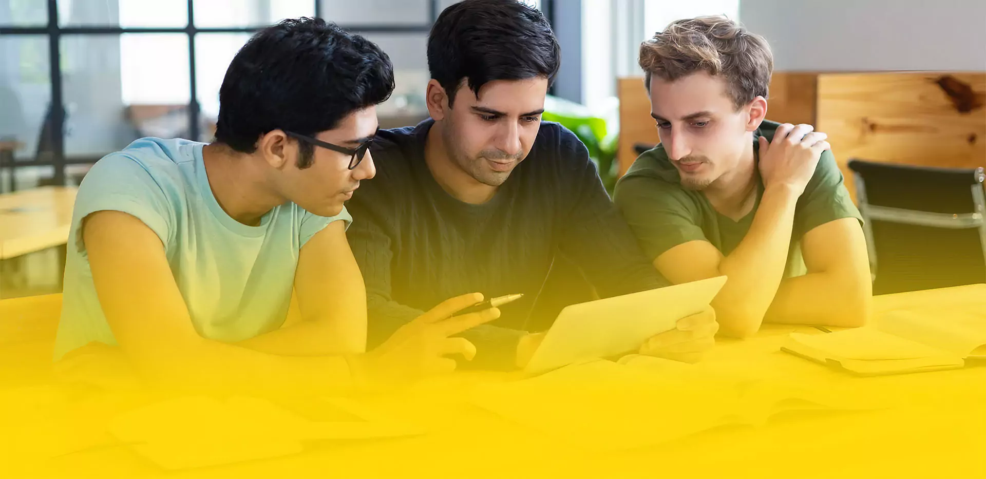 Ideal Junior College Students Engaged in Group Study Sharing a Digital Screen