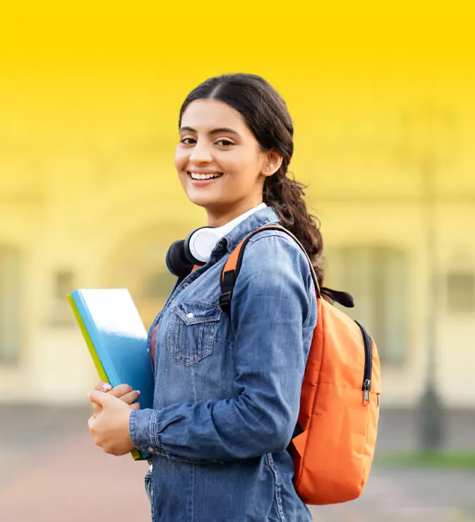 A Young Student Outside with a Notebook, Suggesting a College