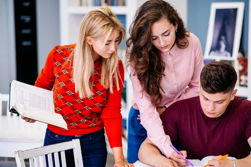 Lecturer Explaining Concepts to Students in a Classroom Setting